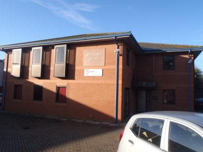 Red brick office building on a sunny day